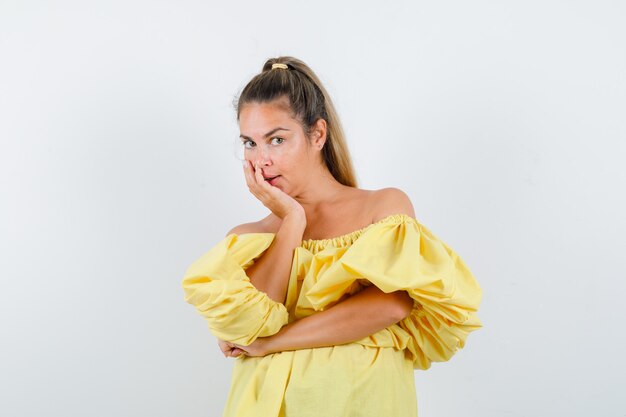 Expressive young girl posing in the studio