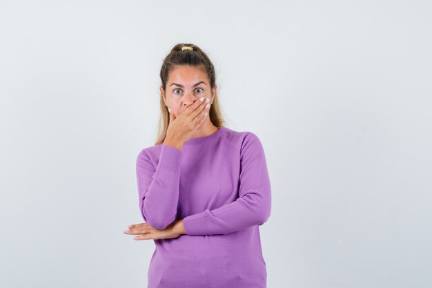 Expressive young girl posing in the studio