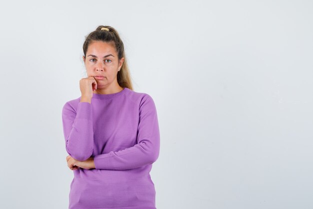 Expressive young girl posing in the studio