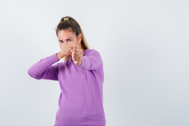 Expressive young girl posing in the studio