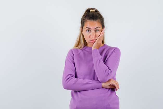 Expressive young girl posing in the studio