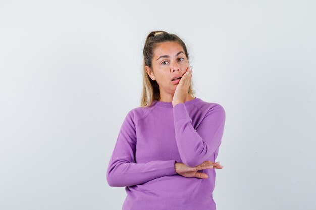 Expressive young girl posing in the studio