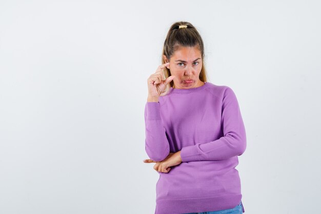 Expressive young girl posing in the studio