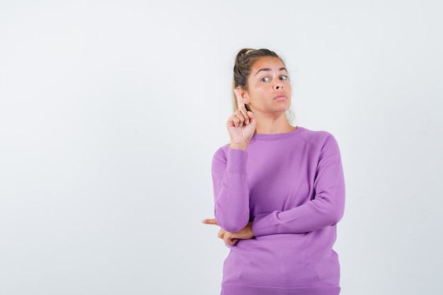 Expressive young girl posing in the studio