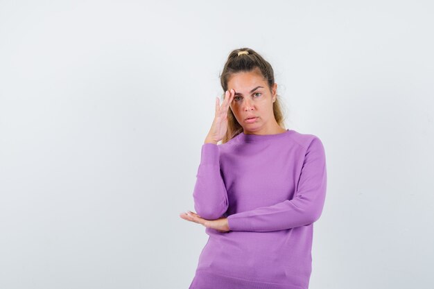 Expressive young girl posing in the studio