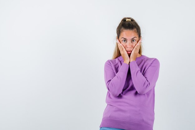 Expressive young girl posing in the studio