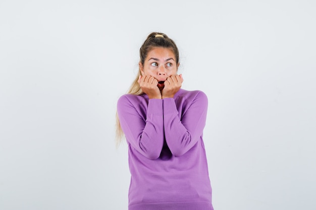 Expressive young girl posing in the studio