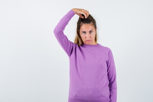 Expressive young girl posing in the studio