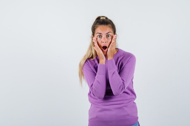 Expressive young girl posing in the studio