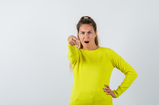 Expressive young girl posing in the studio