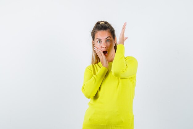 Expressive young girl posing in the studio