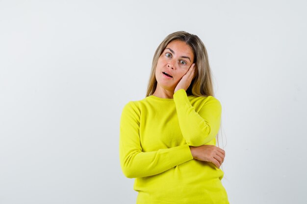 Expressive young girl posing in the studio