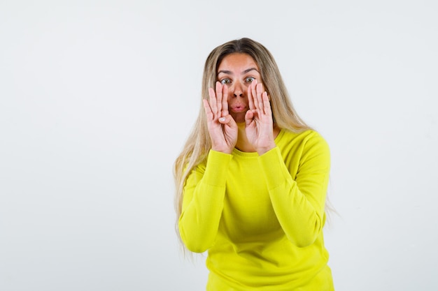 Expressive young girl posing in the studio