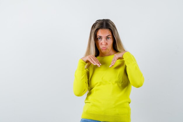 Expressive young girl posing in the studio