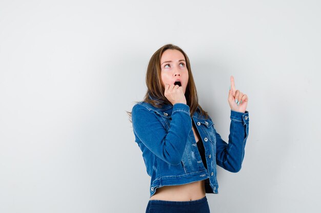 Expressive young girl posing in the studio