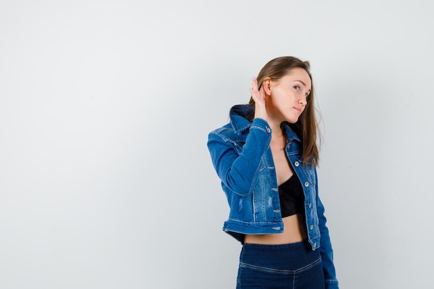 Expressive young girl posing in the studio