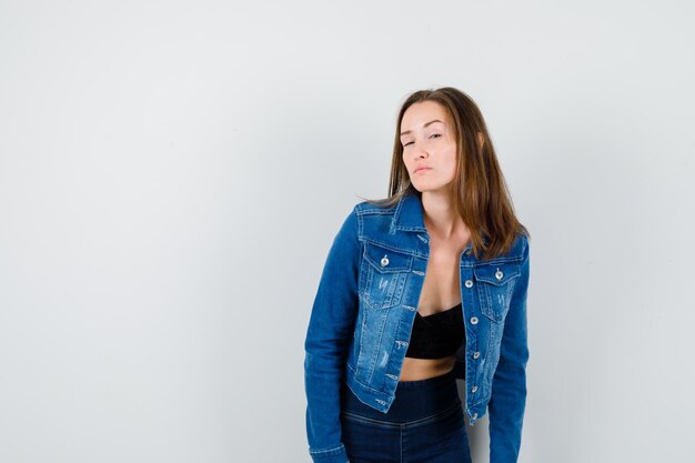 Expressive young girl posing in the studio