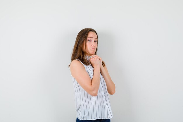 Expressive young girl posing in the studio