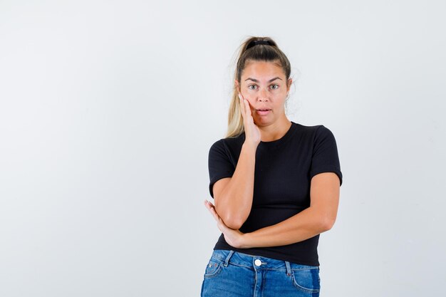 Expressive young girl posing in the studio