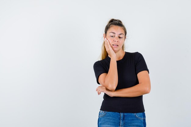 Expressive young girl posing in the studio