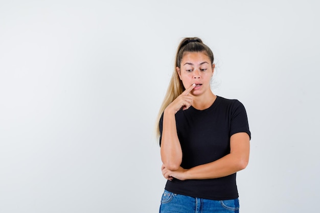 Expressive young girl posing in the studio