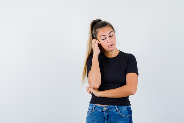 Expressive young girl posing in the studio