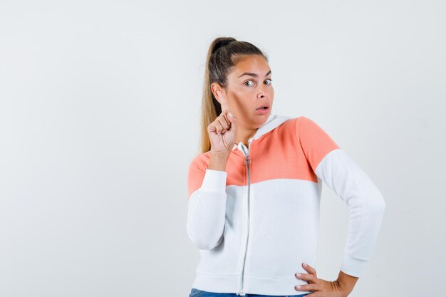 Expressive young girl posing in the studio