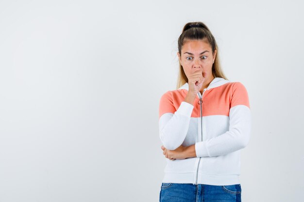 Expressive young girl posing in the studio