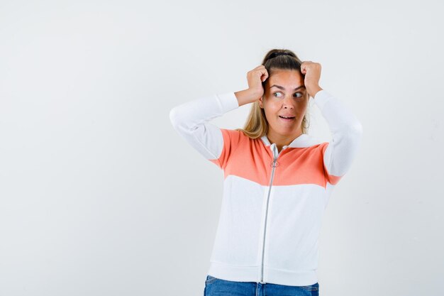 Expressive young girl posing in the studio