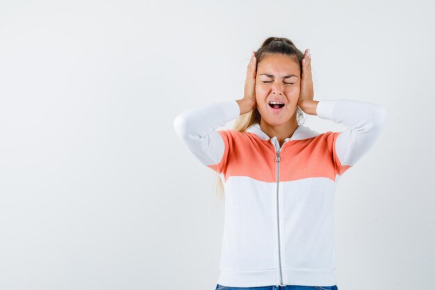 Expressive young girl posing in the studio