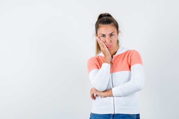 Expressive young girl posing in the studio