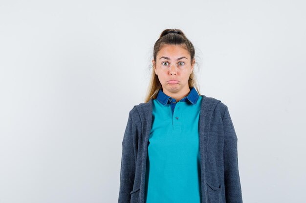 Expressive young girl posing in the studio