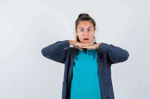 Expressive young girl posing in the studio