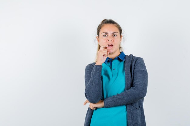 Expressive young girl posing in the studio