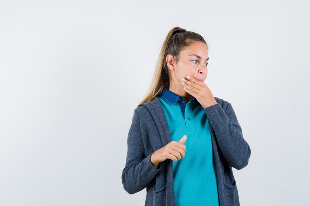 Expressive young girl posing in the studio