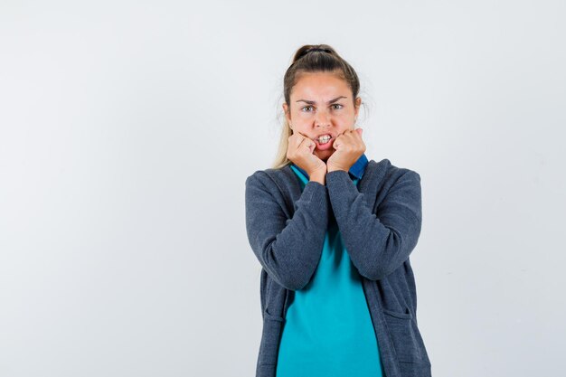 Expressive young girl posing in the studio