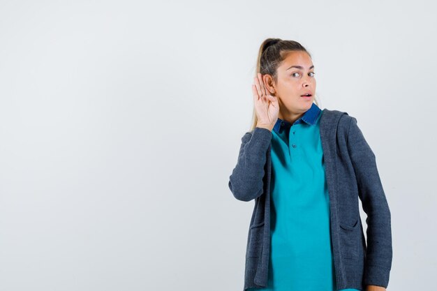 Expressive young girl posing in the studio