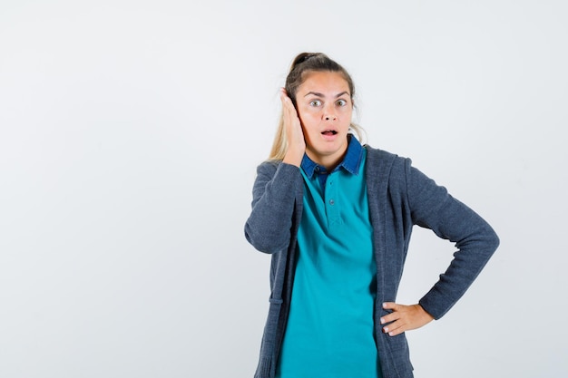 Expressive young girl posing in the studio