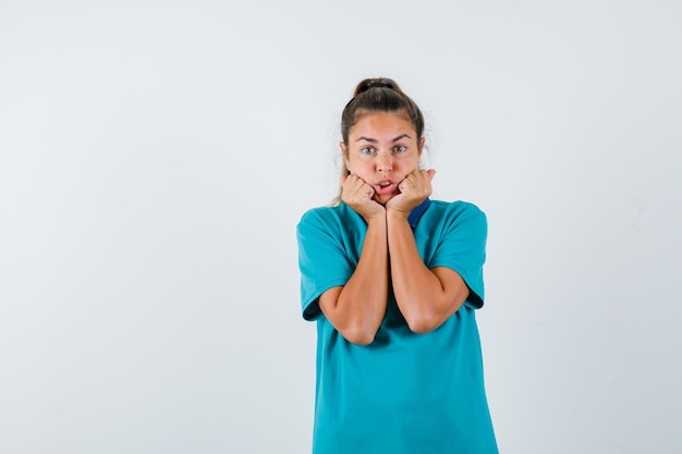 Expressive young girl posing in the studio