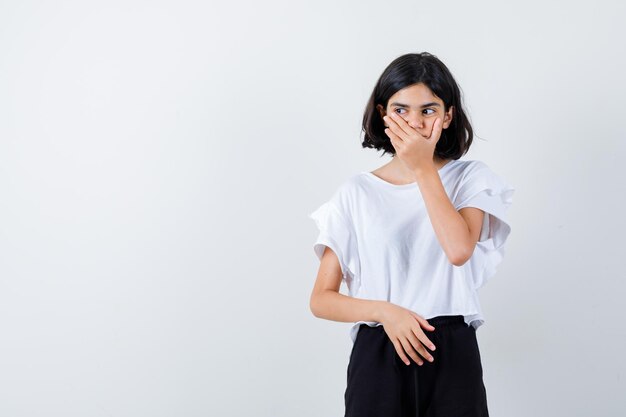 Expressive young girl posing in the studio