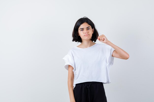 Expressive young girl posing in the studio