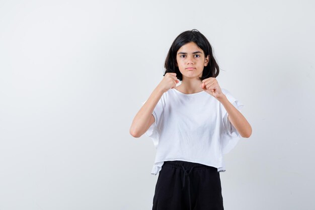 Expressive young girl posing in the studio