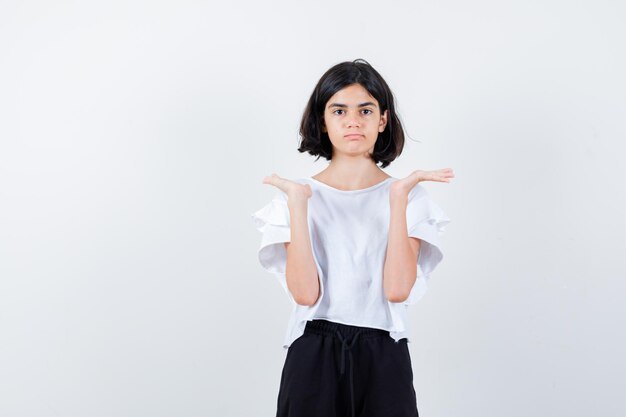 Expressive young girl posing in the studio