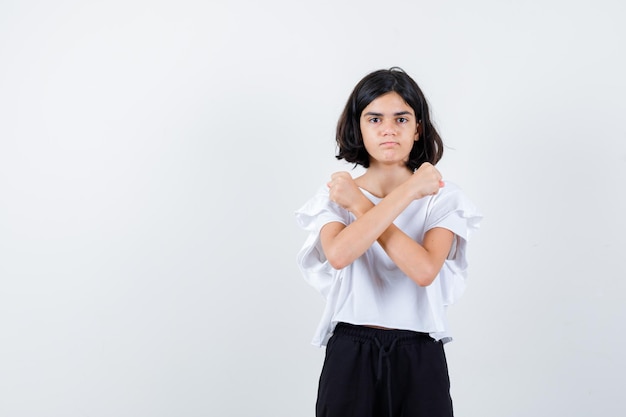 Expressive young girl posing in the studio