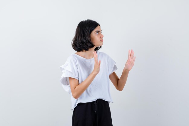 Expressive young girl posing in the studio