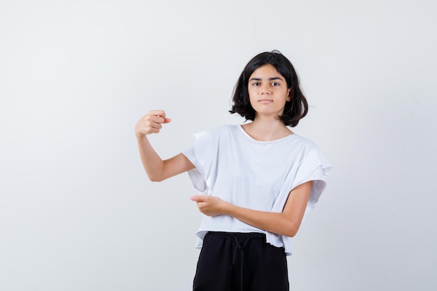 Expressive young girl posing in the studio