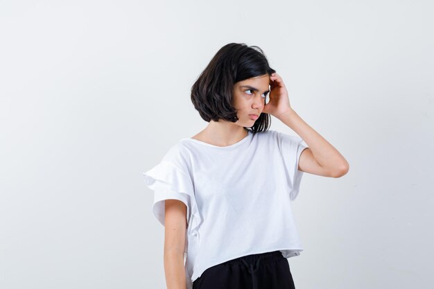 Expressive young girl posing in the studio