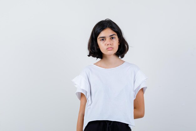 Expressive young girl posing in the studio