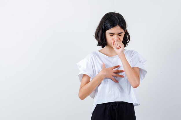 Expressive young girl posing in the studio