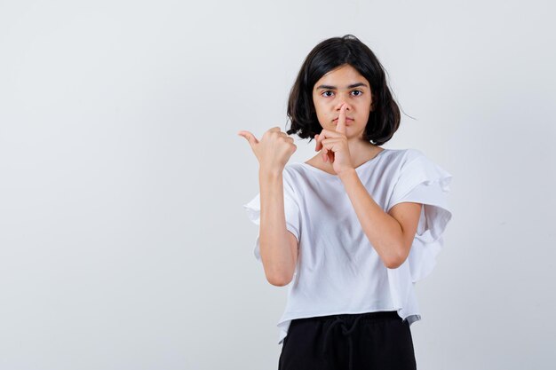 Expressive young girl posing in the studio